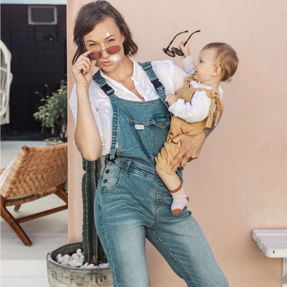 The Mumsie Classic baby wearing overalls